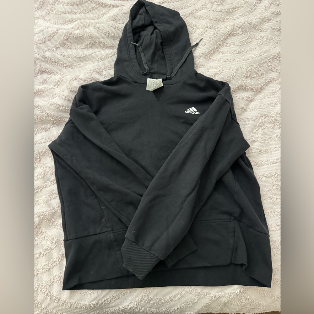 Black adidas hoodie. V neck cut into it. Size small